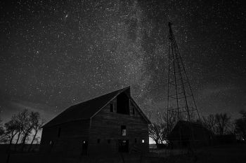 Looking northeast above the barn in McCook County and showing the faint winter Milky Way and the Andromeda galaxy (top left).