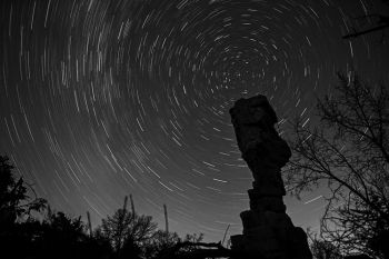 A half hour exposure shows stars circling the North Star above the Balancing Rock formation at Palisades State Park.