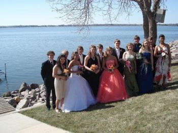 A beautiful daughter, a perfect dress and a bunch of good friends, all ready for prom.