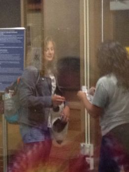 A last view through the airport glass as child #2 prepares to fly east, leaving her South Dakota home behind.