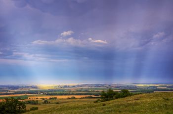Sunrays through storm clouds on top of the Coteau de Prairie south of Sisseton.