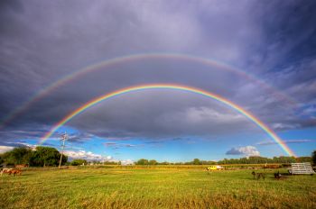 A vibrant double rainbow after a late August shower on the northeast edge of Clark.