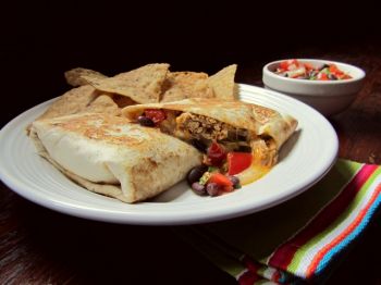 Shredded chicken, black beans and flavorful spices combined make a delicious burrito. Photo by Fran Hill.