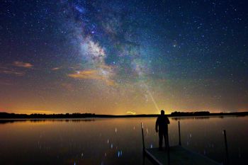 Summer nights can provide glassy water good enough to reflect starlight like this self-portrait with the Milky Way and a lightning bug photo bomb taken at Island Lake last summer.