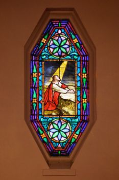A solitary but beautiful stained glass window graces Our Savior’s sanctuary.