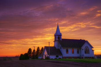 An early May sunset beyond historic Benton Lutheran near Crooks.