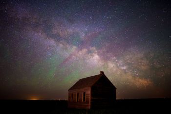 The rising Milky Way with airglow above the old Lightcap country school in Corson County.