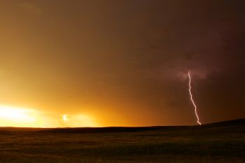 A lightning bolt near sunset on the open prairie of Corson County.