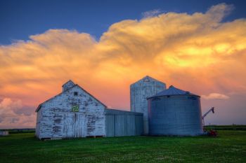 The setting sun coloring the Union County storm as seen from a local farmyard.