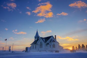Winter’s first blow at sunset at Benton Lutheran Church of rural Crooks.