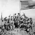 Mitchell native Jack Thurman is shown at the far left, waving his cap, in Joe Rosenthal s famous World War II photograph. Click to enlarge photo.
