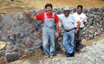 Don Miotke, Fred Miotke and Kenny Okroi have years of wall-building experience. Walls need a strong foundation, but the aboveground look is unique to each mason.