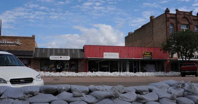 Sandbags have lined both sides of Pierre s main street all summer long, but as it turned out the water boiled up from underneath, causing damage to the stores  basements.