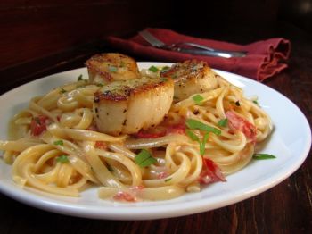 Sweet scallops over linguini could win your Valentine's heart.