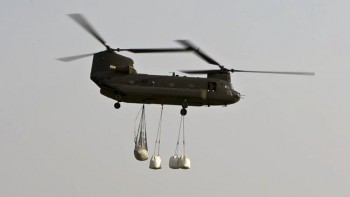 While these CH-47 Chinook helicopters worked with one-ton sandbags, the average sandbag weighs just 30 pounds.