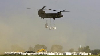 The CH-47 Chinook helicopters could lift several one-ton sandbags.