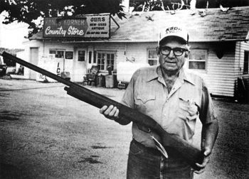 Curt Carter stands in front of the country gas station that he has turned into one of the region's foremost gun shops.