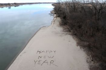 A New Year's greeting is drawn on the Missouri River beach near Yankton.