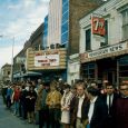 This 1967 photo shows University of South Dakota Students watching for the Dakota Days Parade in front of the old Co-Ed Theater (now Coyote Twin).