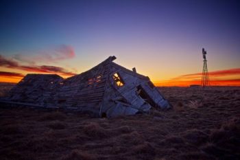 Look for this collapsed farmhouse and standing windmill just south and east of Isabel, in Dewey County.
