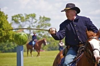 Slicing a watermelon on horseback is good saber practice for the cavalry.