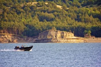 A boater races across the water.