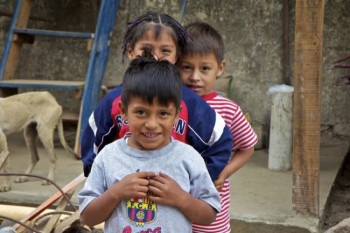Guatemalan children smiling for the camera.