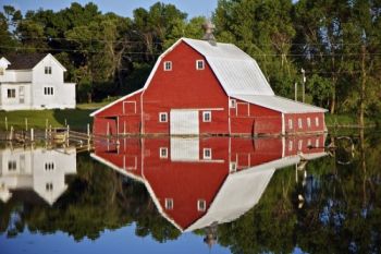 Overflowing lake waters are tough on Marshall County farmers, but create a beautiful mirror image.