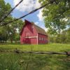 A restored red barn is part of the Adams Homestead and Nature Preserve s homestead area. Photo by Christian Begeman.