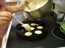 Add the batter to the preheated æbleskiver pan, filling the indentations about 2/3rds full.