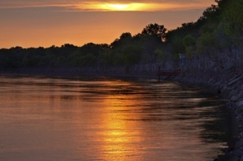 Sunset over a bend in the Missouri River, which borders the park.