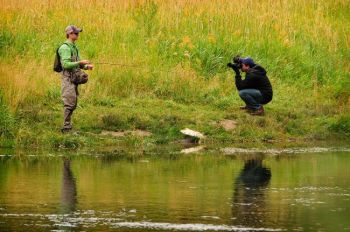 Is it harder to focus on the fish when somebody's watching you? Photo from the 2010 Black Hills Photo Shootout by Chad Coppess of <a href='http://www.dakotagraph.com' target='_blank'>Dakotagraph.</a>