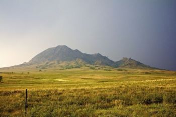 Directly south of the butte as the last of the rain passes and the sunlight reappears.