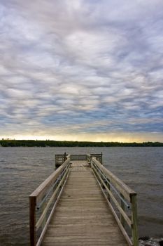 The last of the storm clouds flow over the old fishing dock.