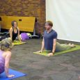 Sean Gallup from The Dharma Room teaches advanced yoga at the 2012 Sioux Falls Yoga Day.