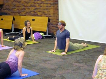 Sean Gallup from The Dharma Room teaches advanced yoga at the 2012 Sioux Falls Yoga Day.