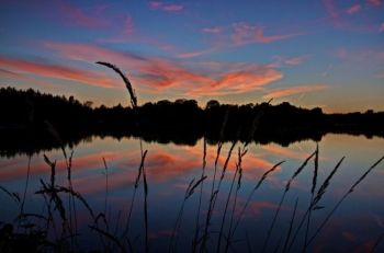 Nearby hills and trees block the wind, making Lake Alvin sunsets picture perfect.