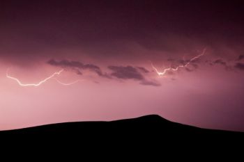 A spring storm over Spirit Mound.