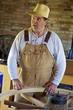 A carpenter explains how wagon wheels are made.