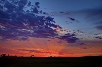 Sunset rays above Benton Lutheran Church just west of Crooks, SD.