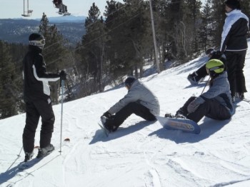 Taking a break while waiting for the snowboarders to strap in.