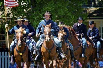 The cavalry enter the old parade grounds.