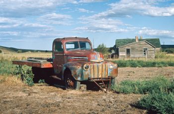 BAD RIVER DAYS. The town of Capa has one man and his dog, a few houses and this truck.