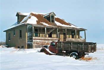 JOE’S AT 20 BELOW. Mostly I’m proud of this picture because it was 20 below zero and blowing as I walked down the hill to get the shot. It’s a Ford from the 1930s.