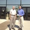 Daktronics helps sports teams around the world keep score. The Brookings company s co-founder Al Kurtenbach, left, is pictured here with South Dakota Magazine publisher Bernie Hunhoff. Photo by Heidi Marsh.