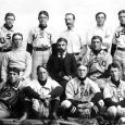 Professor Alexander Pell sits with members of the USD baseball team about 1900.