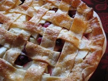 Warm apple cranberry pie with a dollop of vanilla ice cream is the perfect cap to your Thanksgiving meal.