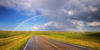 An unexpected shower produced this full rainbow in Brookings County.