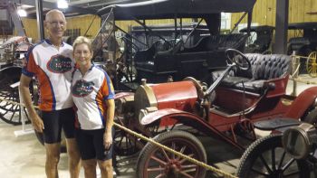 Carl and Jan pose next to Heritage Hall’s 1908 Brush automobile.