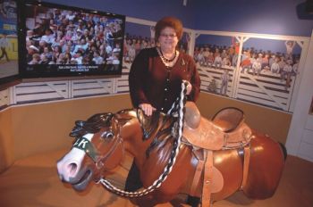 Dayle Tibbs Angyal says visitors to the Casey Tibbs Rodeo Center enjoy the exhibits and a chance to sit on a harmless bronc. Photo by Bernie Hunhoff.